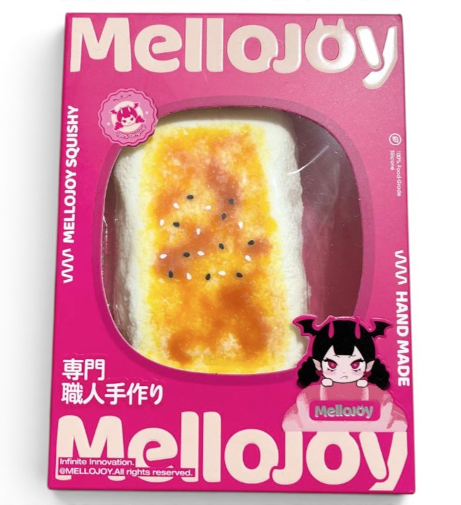 マイストアのメロジョイ大満足焼き餅。こんがり焼けた餅をモチーフにした、なめらかな触感のシリコン製スクイーズ玩具のパッケージ。